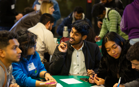 Five alumni networking at a UCD Alumni event.